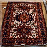 D015. Handknotted red and ivory rug. 4'9” x 3'4” - $375